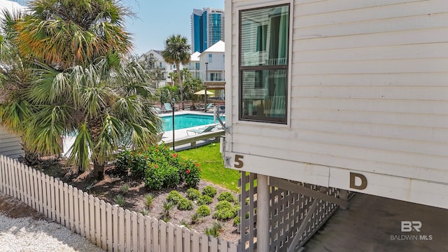 view of pool with a fenced in pool, a patio, and fence