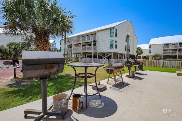 surrounding community featuring fence and a lawn