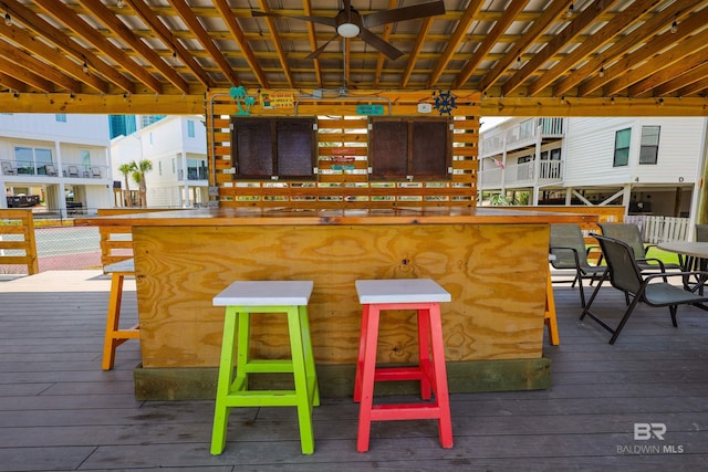 wooden terrace featuring outdoor dry bar