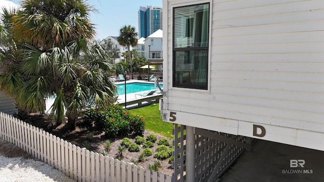 view of pool featuring a fenced in pool, a patio, and fence