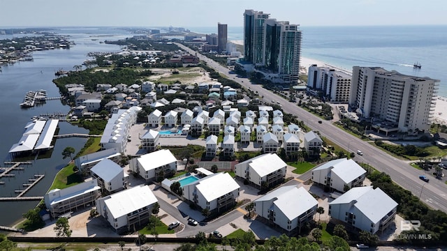 birds eye view of property with a view of city and a water view