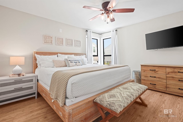 bedroom with light wood finished floors and ceiling fan