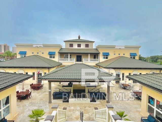 27269 Perdido Beach Blvd Unit C5A, Orange Beach, AL 36561 - rear view of property featuring a gazebo, outdoor dining area, and a patio