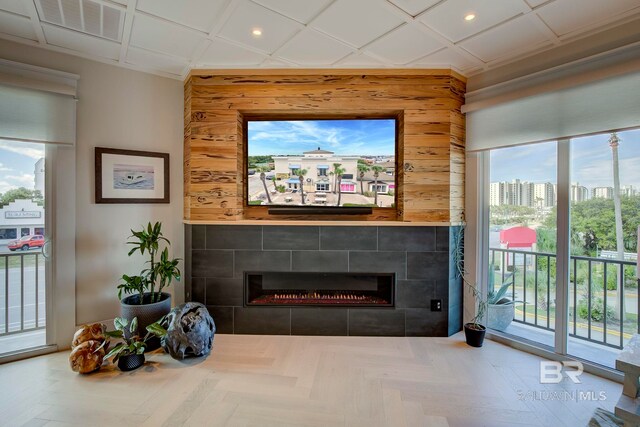 27269 Perdido Beach Blvd Unit C5A, Orange Beach, AL 36561 - living area featuring a tile fireplace, healthy amount of natural light, recessed lighting, and wood walls