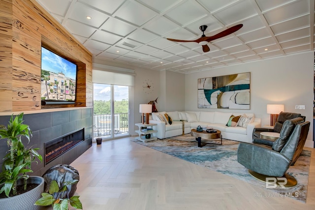 27269 Perdido Beach Blvd Unit C5A, Orange Beach, AL 36561 - living room featuring ceiling fan, recessed lighting, a tile fireplace, coffered ceiling, and baseboards