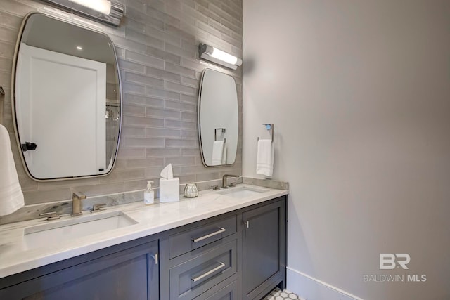 27269 Perdido Beach Blvd Unit C5A, Orange Beach, AL 36561 - full bathroom with backsplash, double vanity, and baseboards