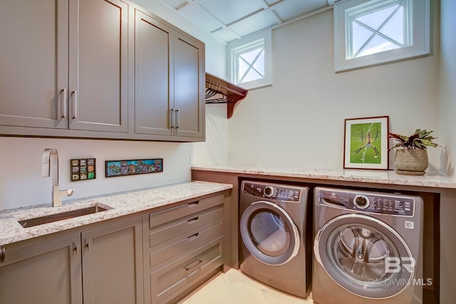 27269 Perdido Beach Blvd Unit C5A, Orange Beach, AL 36561 - laundry area featuring cabinet space and washer and dryer