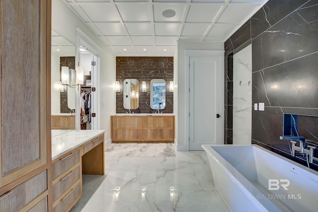 27269 Perdido Beach Blvd Unit C5A, Orange Beach, AL 36561 - bathroom featuring a freestanding tub, marble finish flooring, vanity, and recessed lighting