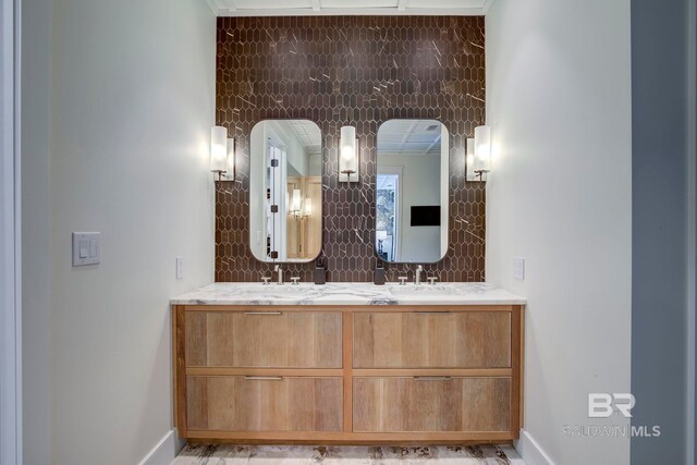 27269 Perdido Beach Blvd Unit C5A, Orange Beach, AL 36561 - bathroom featuring tasteful backsplash, baseboards, and double vanity