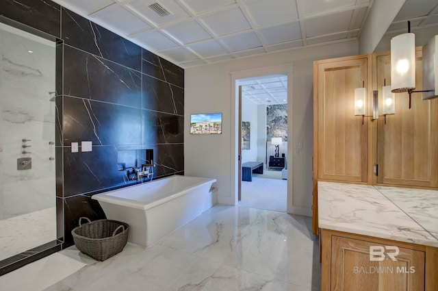 27269 Perdido Beach Blvd Unit C5A, Orange Beach, AL 36561 - full bathroom with marble tiled floors, a soaking tub, walk in shower, and tile walls