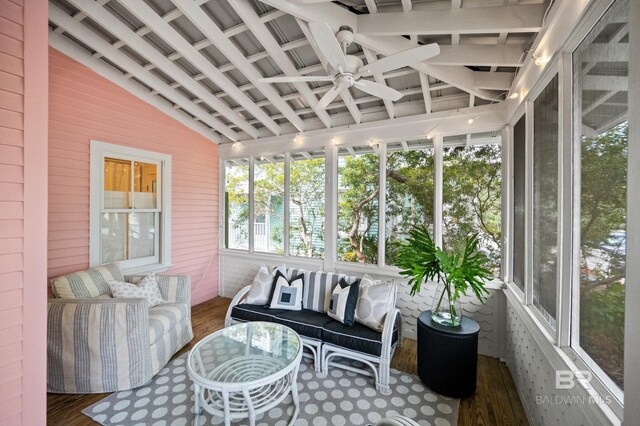 sunroom / solarium with an outdoor hangout area and a ceiling fan