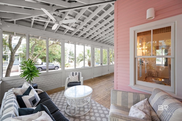 sunroom featuring ceiling fan