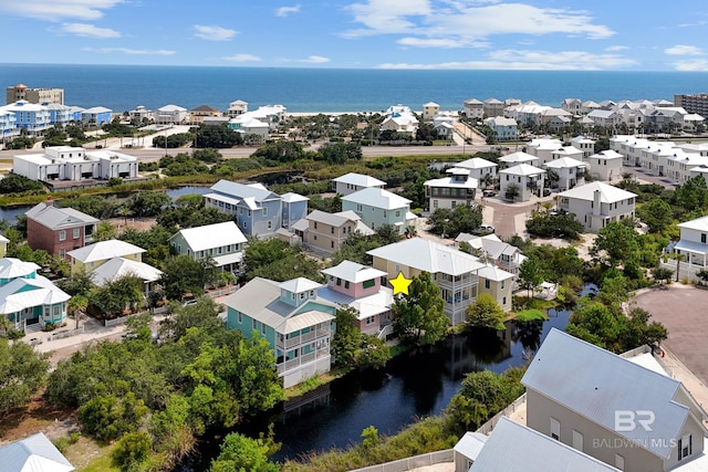 bird's eye view featuring a water view and a residential view