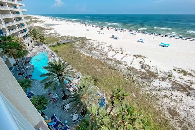 birds eye view of property featuring a water view and a view of the beach