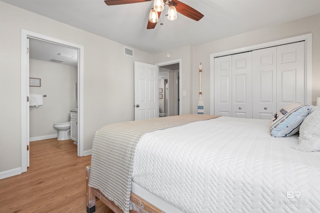 26115 Perdido Beach Blvd Unit 5D, Orange Beach, AL 36561 - bedroom with light wood finished floors, baseboards, a closet, ceiling fan, and ensuite bathroom