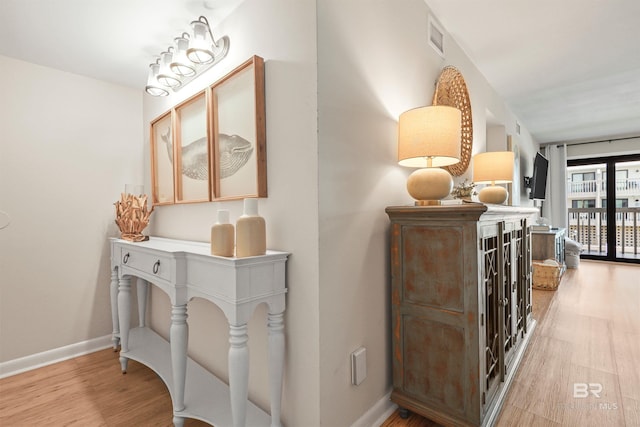 26115 Perdido Beach Blvd Unit 5D, Orange Beach, AL 36561 - corridor featuring wood finished floors and baseboards