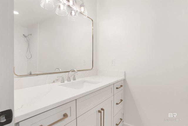 full bath featuring a shower and vanity