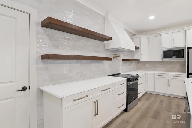 kitchen featuring custom exhaust hood, open shelves, tasteful backsplash, electric range oven, and built in microwave