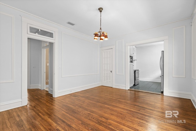 24 Macy Pl, Mobile, AL 36604 - unfurnished room with a chandelier, dark wood-style floors, baseboards, and ornamental molding