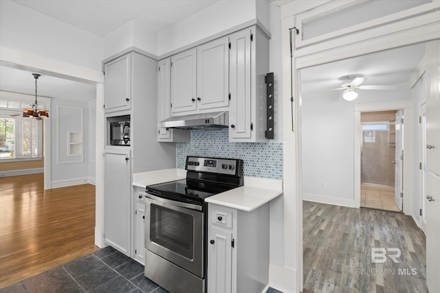 24 Macy Pl, Mobile, AL 36604 - kitchen featuring stainless steel range with electric stovetop, under cabinet range hood, light countertops, a chandelier, and black microwave