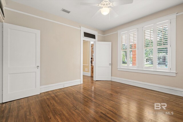 24 Macy Pl, Mobile, AL 36604 - unfurnished bedroom featuring wood finished floors, baseboards, and ceiling fan
