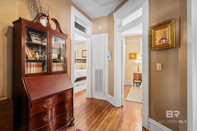 24 Macy Pl, Mobile, AL 36604 - hallway featuring wood finished floors and baseboards