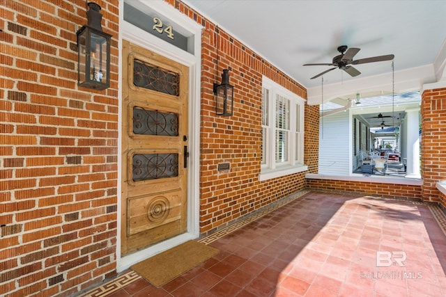 24 Macy Pl, Mobile, AL 36604 - view of exterior entry with covered porch, brick siding, and ceiling fan