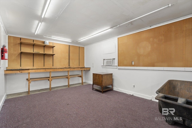 24 Macy Pl, Mobile, AL 36604 - below grade area with a workshop area, baseboards, and carpet