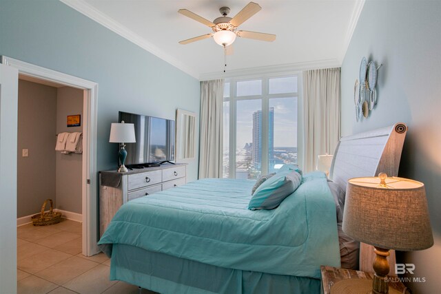 tiled bedroom featuring ornamental molding and ceiling fan