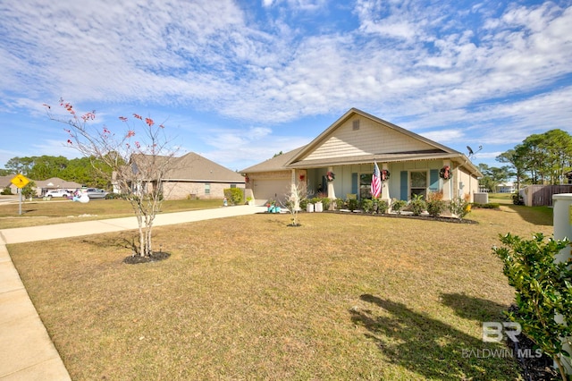 view of front of house with a garage, a front yard, and covered porch