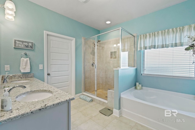 bathroom with tile patterned flooring, vanity, and separate shower and tub