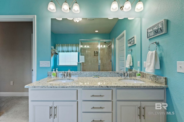 bathroom featuring vanity and an enclosed shower