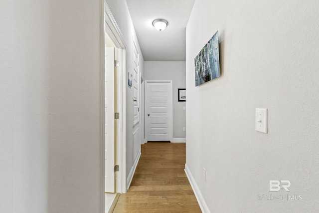 corridor featuring light hardwood / wood-style floors