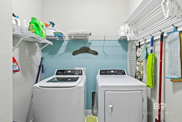 laundry area with washing machine and dryer