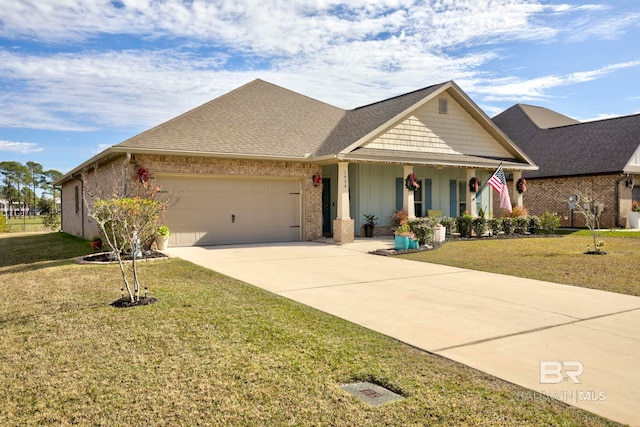 view of front facade featuring a garage, covered porch, and a front yard