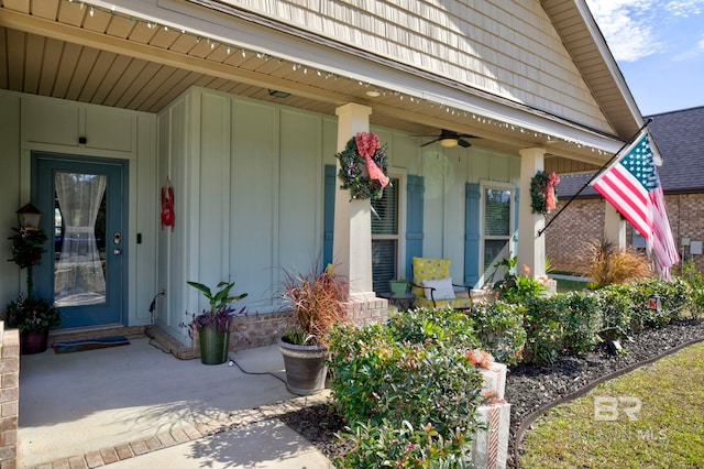 entrance to property with ceiling fan and covered porch