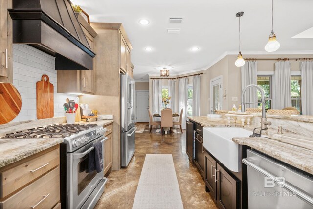 4331 Hamilton Oaks Ln, Mobile, AL 36695 - kitchen with appliances with stainless steel finishes, a sink, crown molding, healthy amount of natural light, and wall chimney exhaust hood