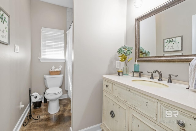 4331 Hamilton Oaks Ln, Mobile, AL 36695 - full bath featuring baseboards, toilet, vanity, concrete floors, and a shower with shower curtain