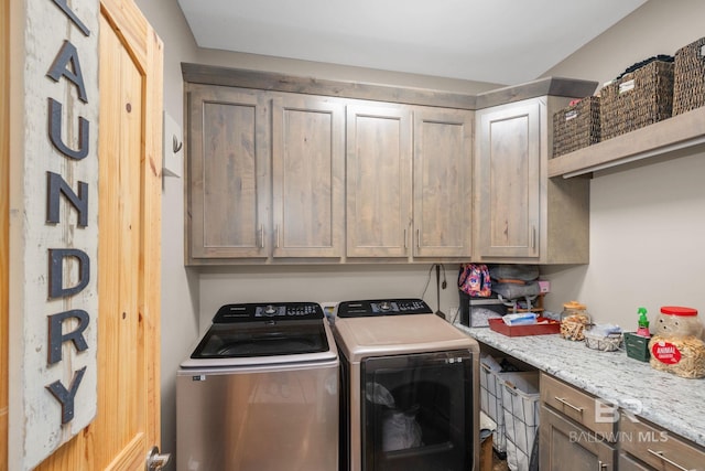 4331 Hamilton Oaks Ln, Mobile, AL 36695 - laundry room with cabinet space and washing machine and clothes dryer