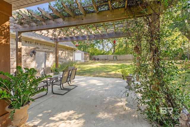 4331 Hamilton Oaks Ln, Mobile, AL 36695 - view of patio / terrace featuring a storage shed, an outdoor structure, a pergola, and outdoor dining space
