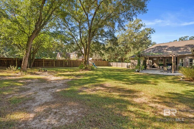 4331 Hamilton Oaks Ln, Mobile, AL 36695 - view of yard featuring a patio area and a playground