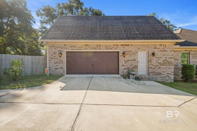 4331 Hamilton Oaks Ln, Mobile, AL 36695 - garage featuring fence and driveway