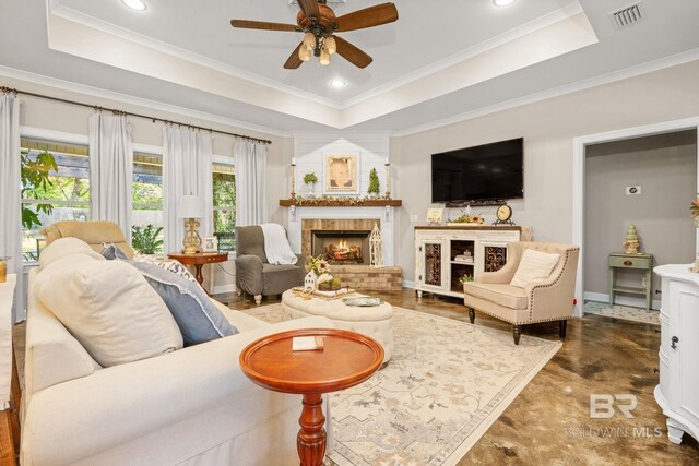 4331 Hamilton Oaks Ln, Mobile, AL 36695 - living area with a tray ceiling, a ceiling fan, a warm lit fireplace, ornamental molding, and recessed lighting
