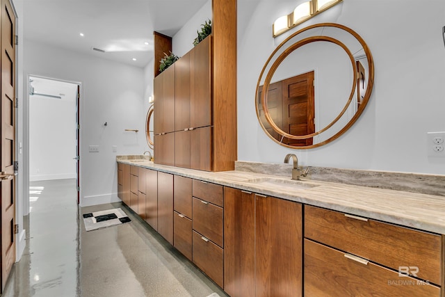 bathroom featuring double vanity