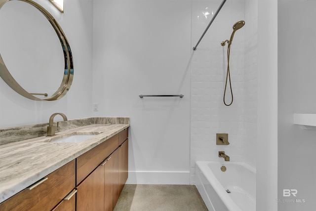 bathroom with vanity and tiled shower / bath