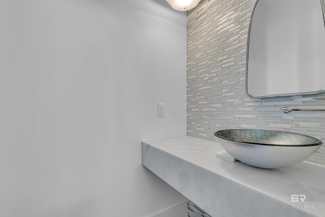 bathroom featuring backsplash and vanity