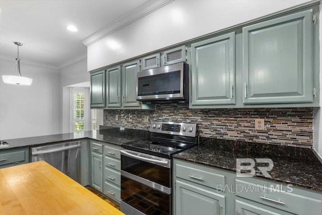 6505 Charing Wood Dr, Mobile, AL 36695 - kitchen with appliances with stainless steel finishes, crown molding, decorative backsplash, pendant lighting, and gray cabinets