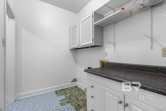 6505 Charing Wood Dr, Mobile, AL 36695 - washroom with hookup for a washing machine and cabinet space