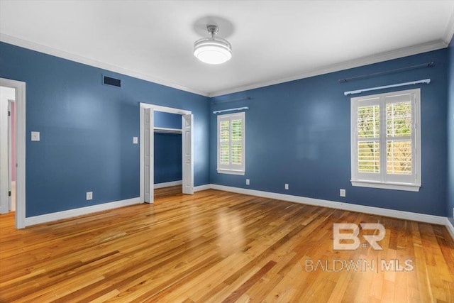 6505 Charing Wood Dr, Mobile, AL 36695 - unfurnished bedroom featuring wood finished floors, ornamental molding, and a closet