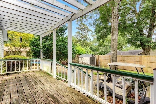 6505 Charing Wood Dr, Mobile, AL 36695 - wooden deck featuring a storage shed, a fenced backyard, and a pergola